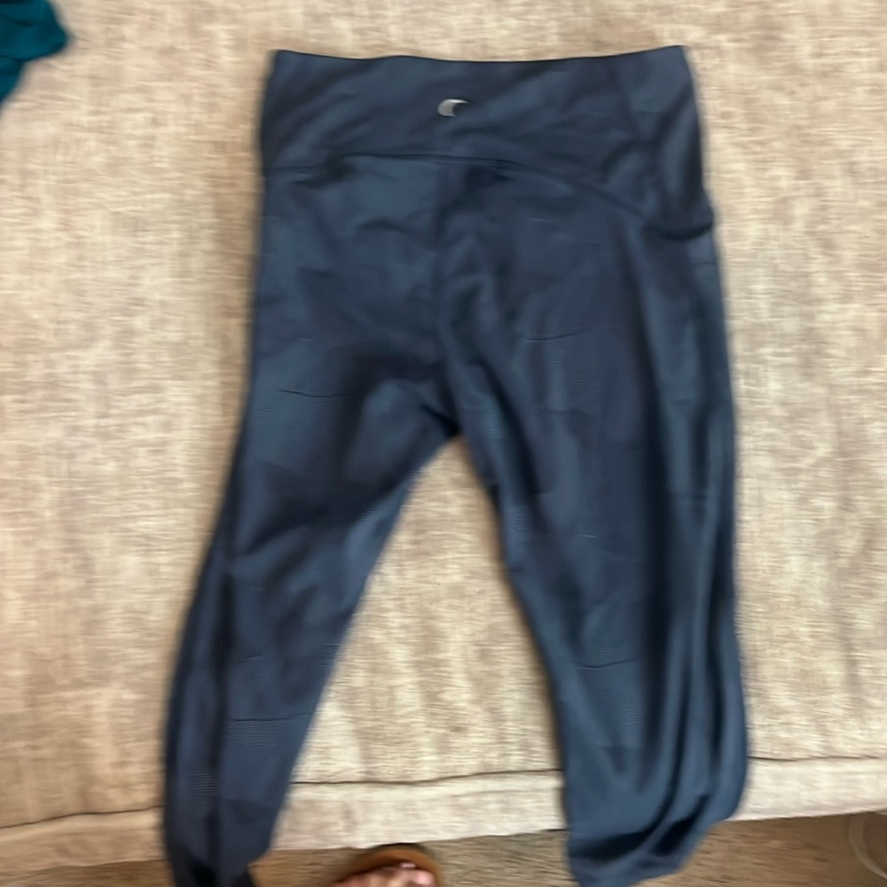 Blue Zyia leggings with swirls on design